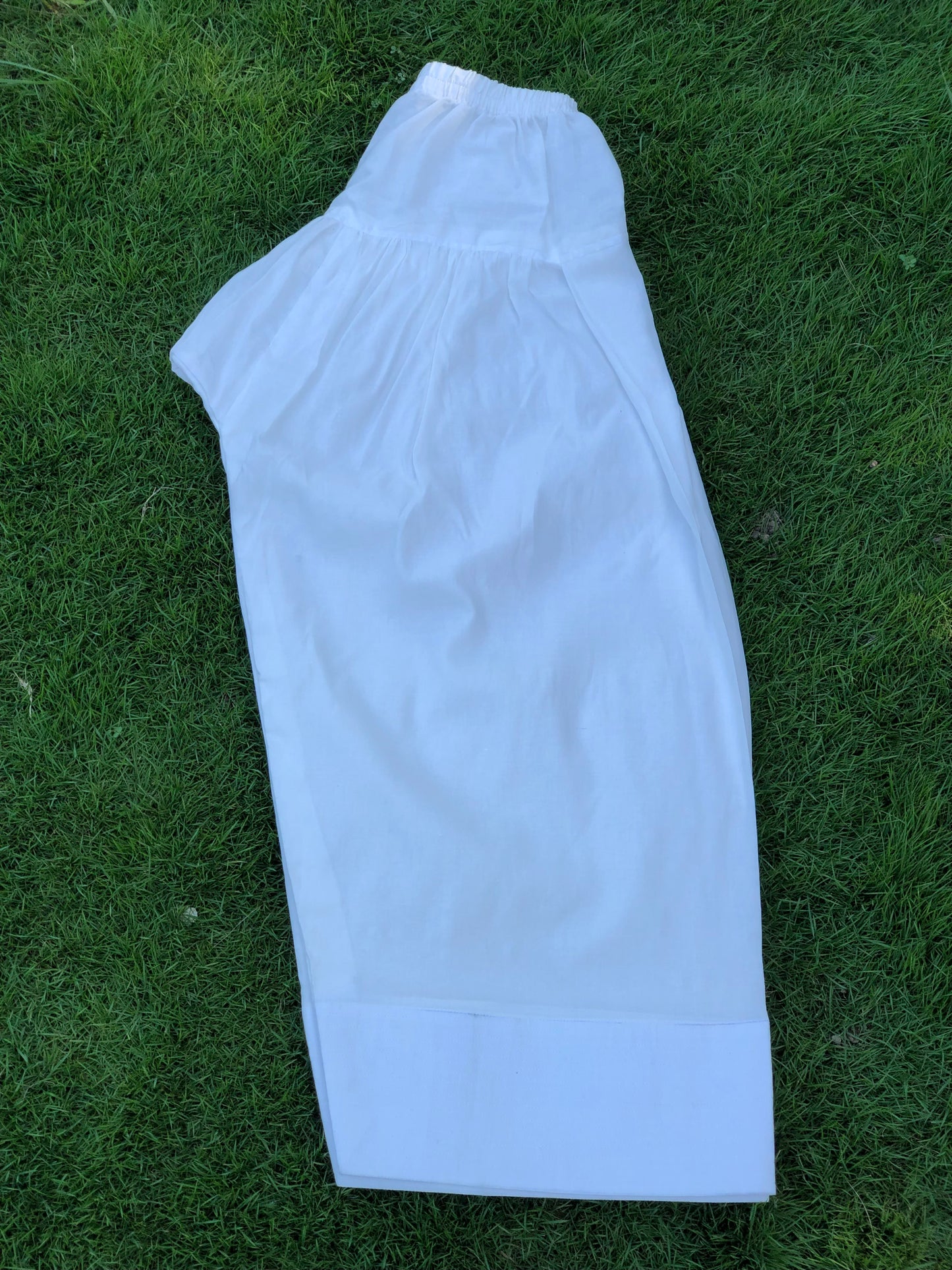 White pants on a grassy background