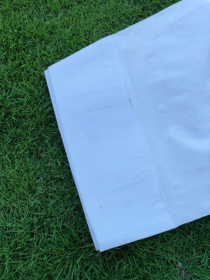 White fabric on green grass