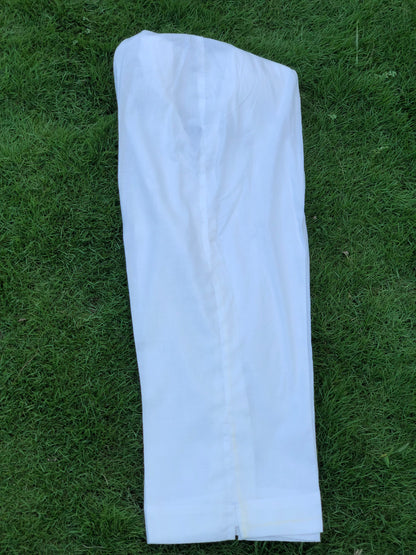 White pants on a grassy background