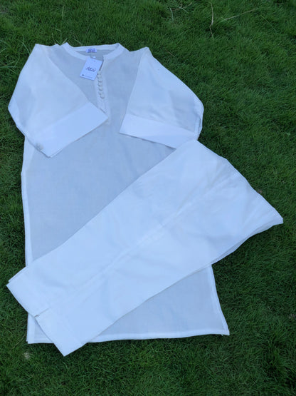 White blouse with ruffled details on a grassy background