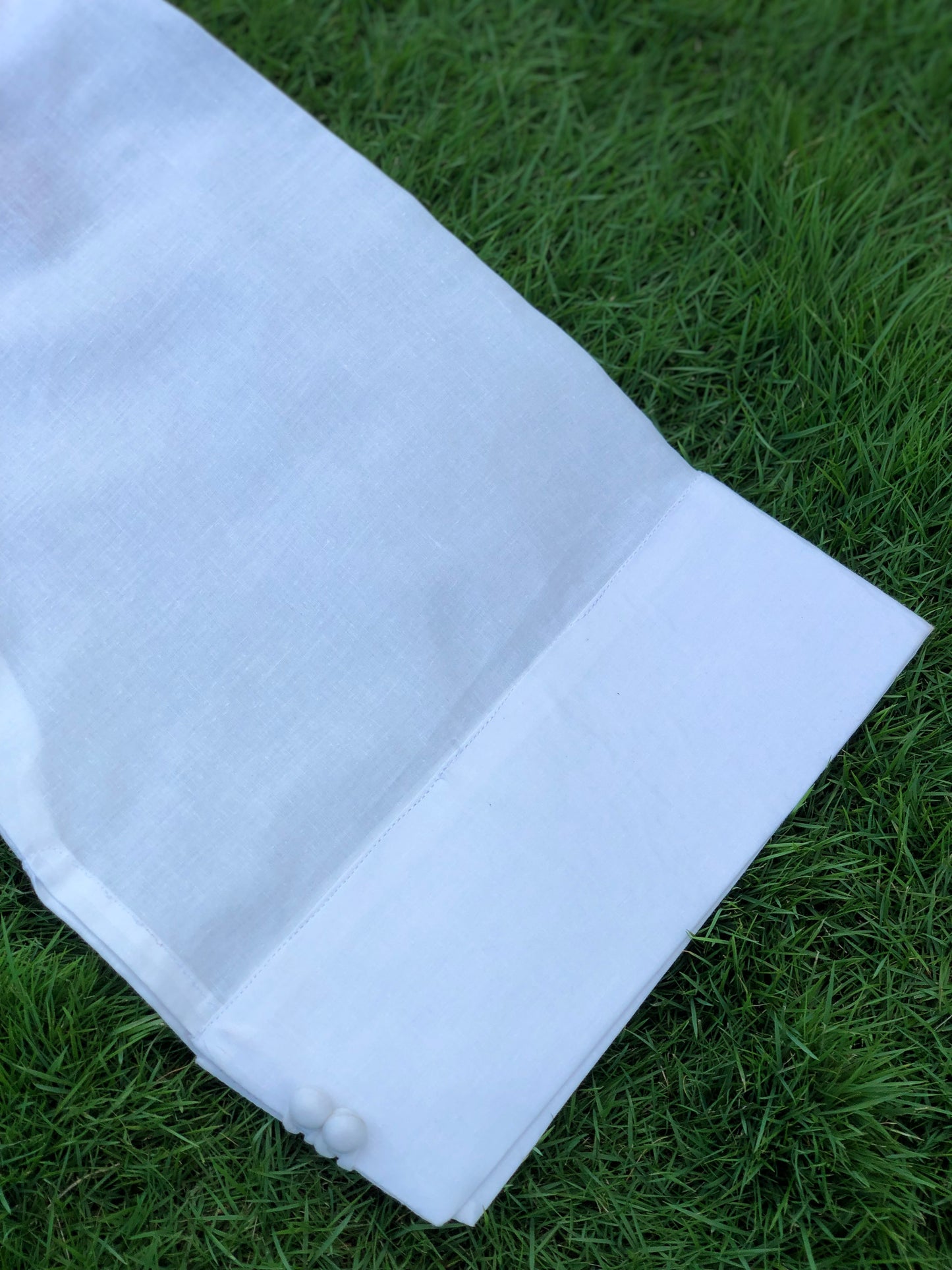 White fabric on green grass