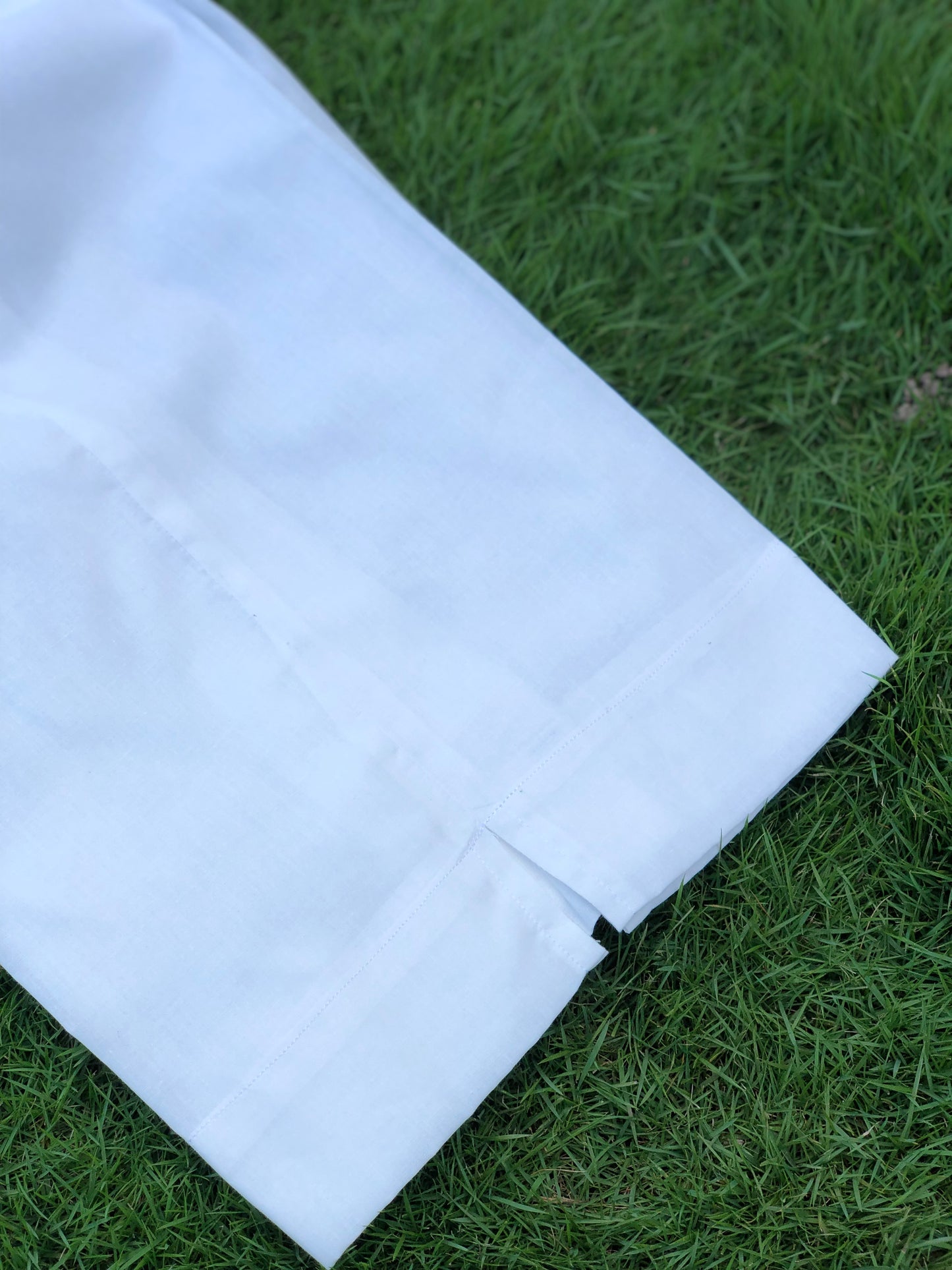 White fabric on green grass